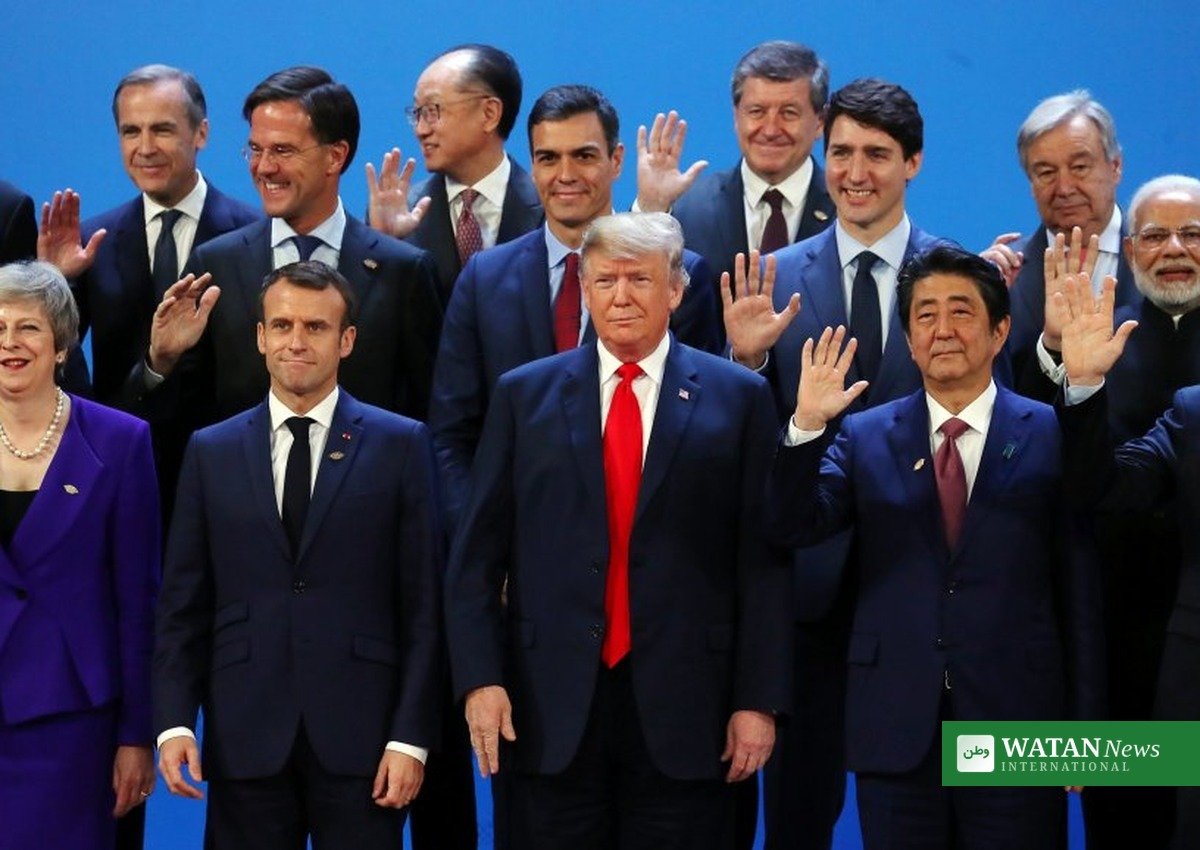 G20 summit leaders pose for a group photo at a previous leaders summit