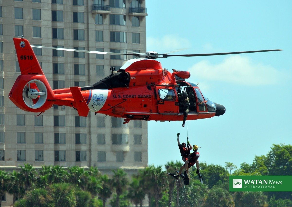 California smuggling boat rescue — U.S. Coast Guard helicopter hoist rescue at sea