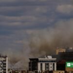 Kyiv missiles peace talks: smoke rises over residential buildings in Kyiv after a missile attack