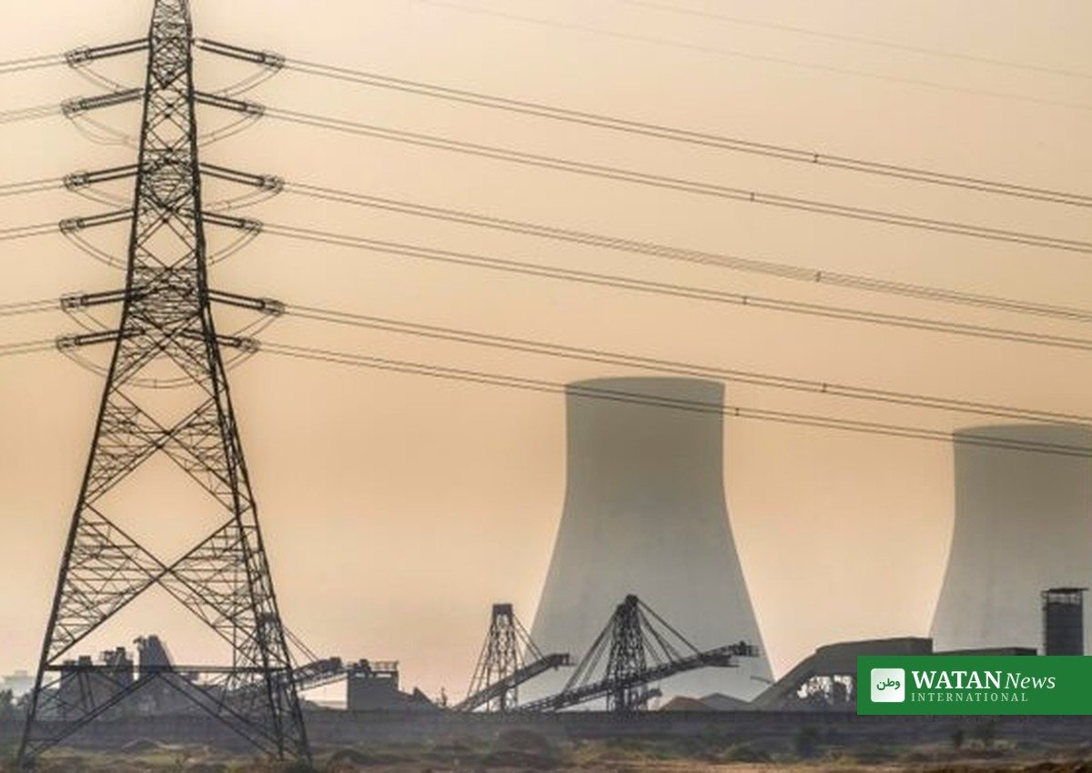 India coal plants low fuel: cooling towers and transmission lines at a coal-fired power station in India