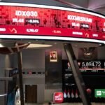 Indonesia stocks rebound: Jakarta Composite Index ticker boards flash red at the Indonesia Stock Exchange