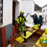 Firefighter places sandbags as Storm Adam floods rise in eastern Spain