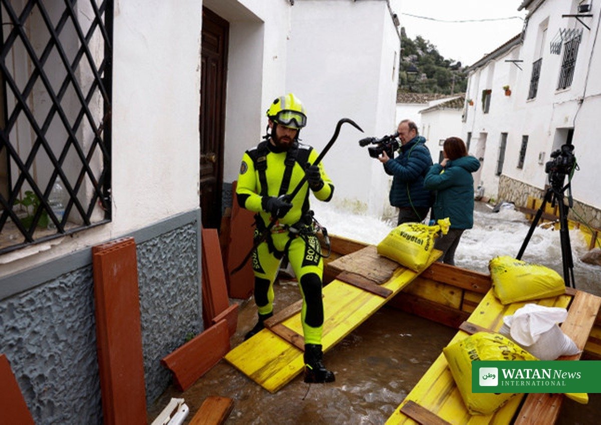 Firefighter places sandbags as Storm Adam floods rise in eastern Spain