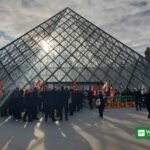 Student protesters staging the Louvre protest blockade in front of the glass pyramid, Paris