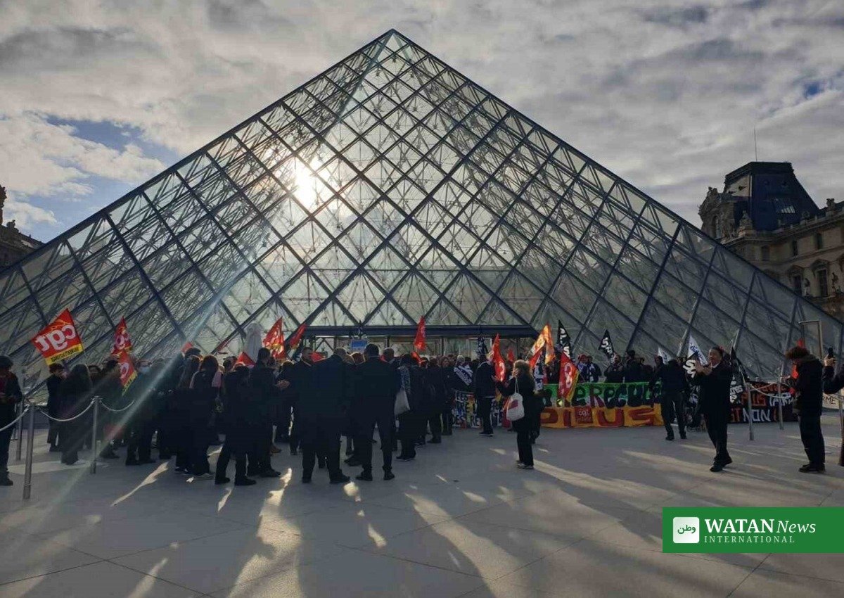 Student protesters staging the Louvre protest blockade in front of the glass pyramid, Paris