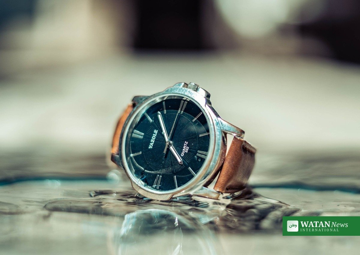 Luxury watch auction: elegant wristwatch with leather strap under the hammer