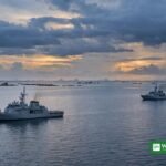 China Philippines tensions — two vessels keeping distance in the South China Sea