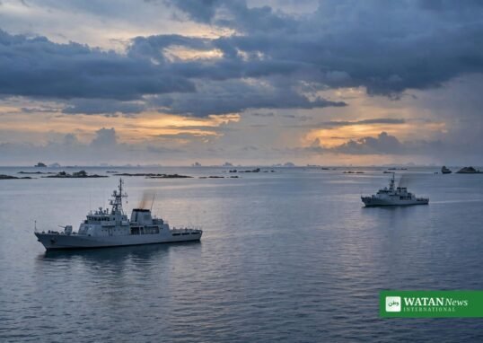 China Philippines tensions — two vessels keeping distance in the South China Sea