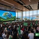 COY21 youth climate conference — young people gathered in a coastal auditorium