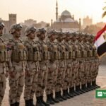 Egyptian soldiers in formation in Cairo with the Egyptian flag