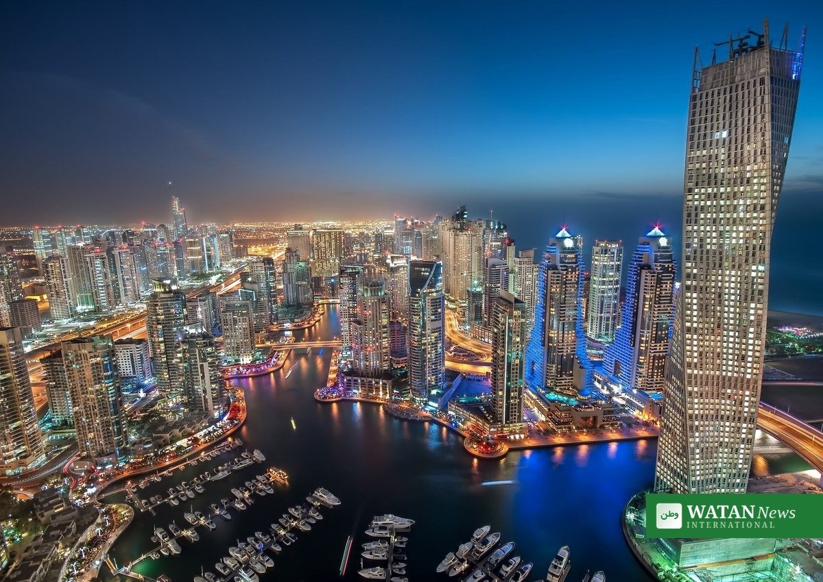 Dubai Marina skyline glowing at night - a luxury destinations city landmark
