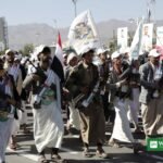 Armed Houthi supporters march in Sanaa amid the Houthi attacks on Saudi airports