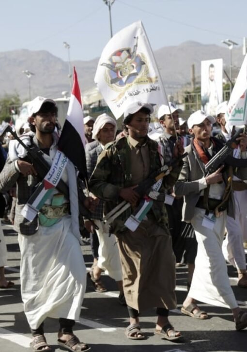 Armed Houthi supporters march in Sanaa amid the Houthi attacks on Saudi airports