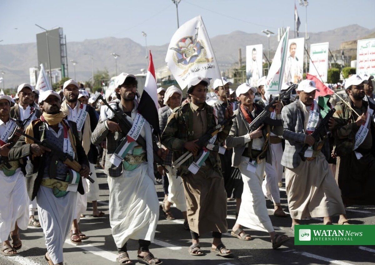 Armed Houthi supporters march in Sanaa amid the Houthi attacks on Saudi airports
