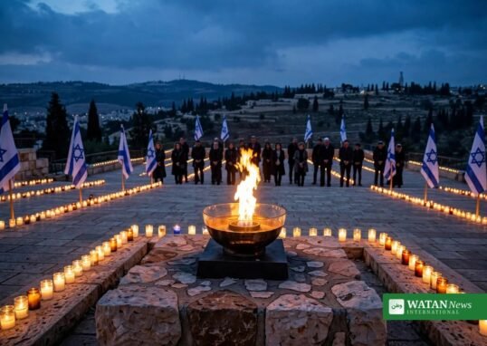 Memorial flame and candles at an Israel Oct 7 anniversary commemoration with Israeli flags