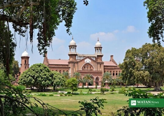 Lahore High Court building in Lahore, Pakistan — red-brick colonial Indo-Saracenic courthouse with twin domed towers