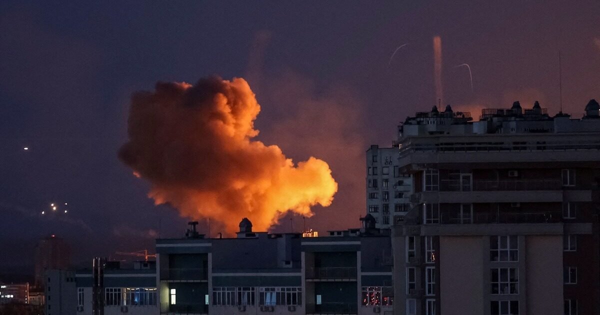 Night missile strike on Kyiv — fireball rising over apartment buildings