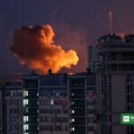Night missile strike on Kyiv — fireball rising over apartment buildings
