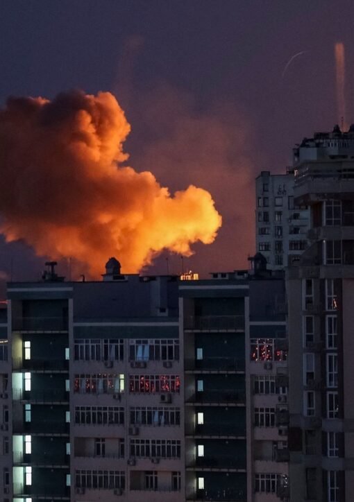 Night missile strike on Kyiv — fireball rising over apartment buildings