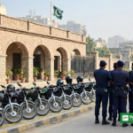 Rawalpindi Police arrests – police officers with recovered stolen motorcycles at a police station in Rawalpindi