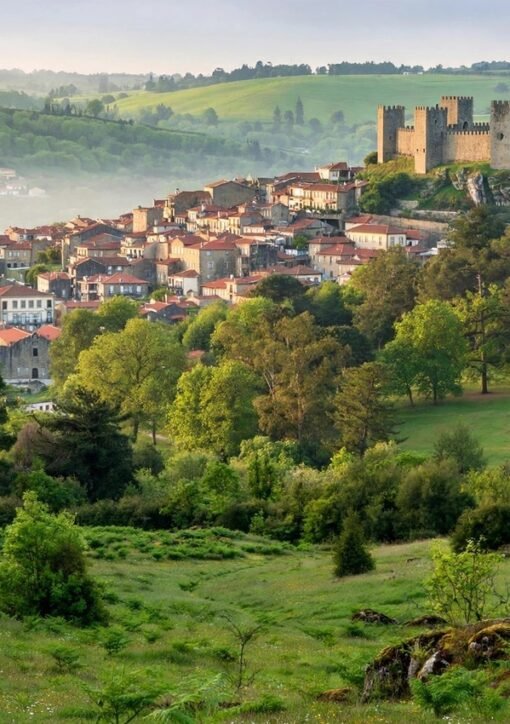 Guimarães castle and old town surrounded by green hills — the 2026 European Green Capital hosts the 2028 winners' announcement on 8 October