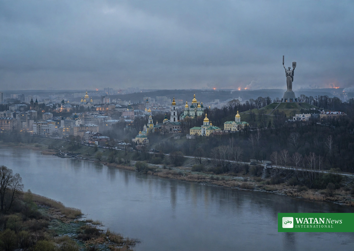Kyiv skyline at dawn with the Motherland Monument and golden-domed churches, glow of distant explosions on the horizon after Russian strikes on Kyiv energy facilities