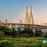 Mumbai skyline and Bandra-Worli Sea Link at dusk with green park in foreground — host city of the Earthshot Prize Summit Mumbai 2026