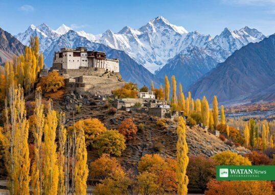 Hunza autumn — Baltit Fort above golden poplar trees