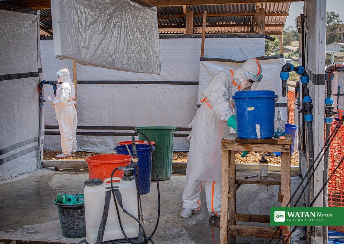 Kenya Ebola case: health worker disinfecting at an Ebola treatment centre