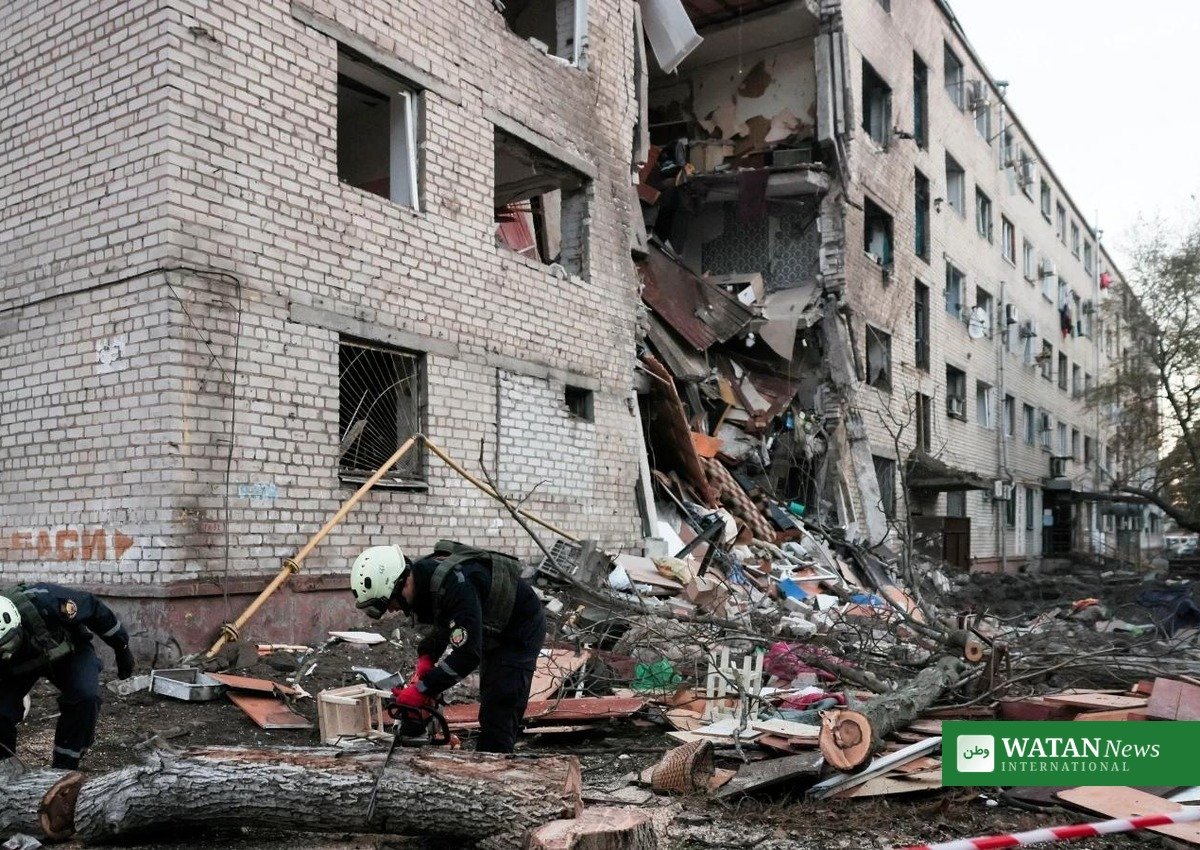 Rescue workers at a destroyed residential building after the Russian strike on Ukraine, October 2026