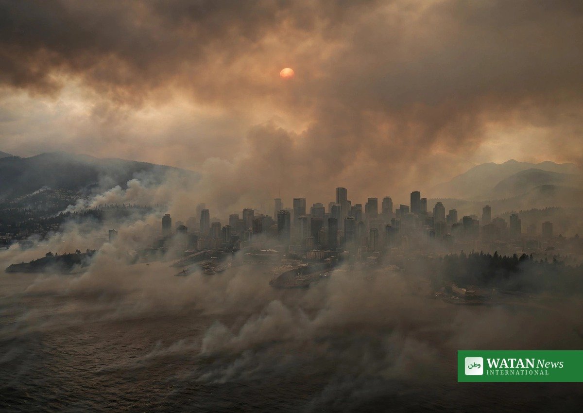 A Canadian city shrouded in orange wildfire smoke haze during the 2026 fire season