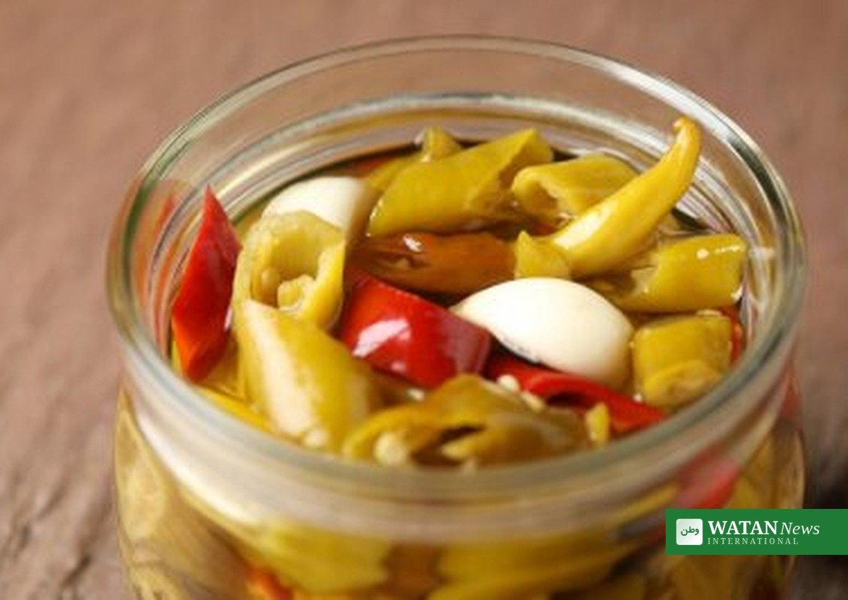 Close-up of pickled peperoncini peppers in a jar during the peperoncini recall