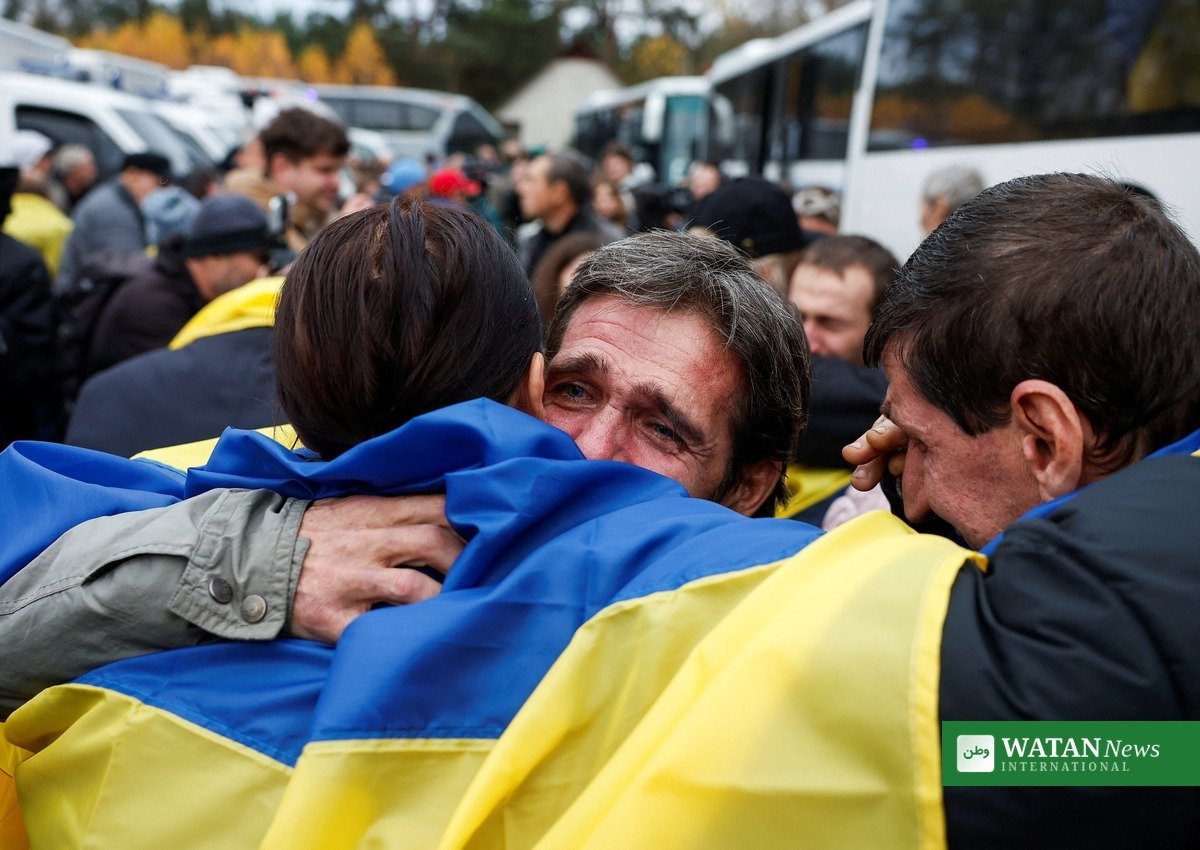Oleshky evacuees embracing loved ones after arriving back in Ukraine