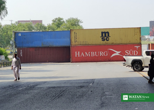Shipping containers blocking a road into Islamabad during the PTI protest lockdown