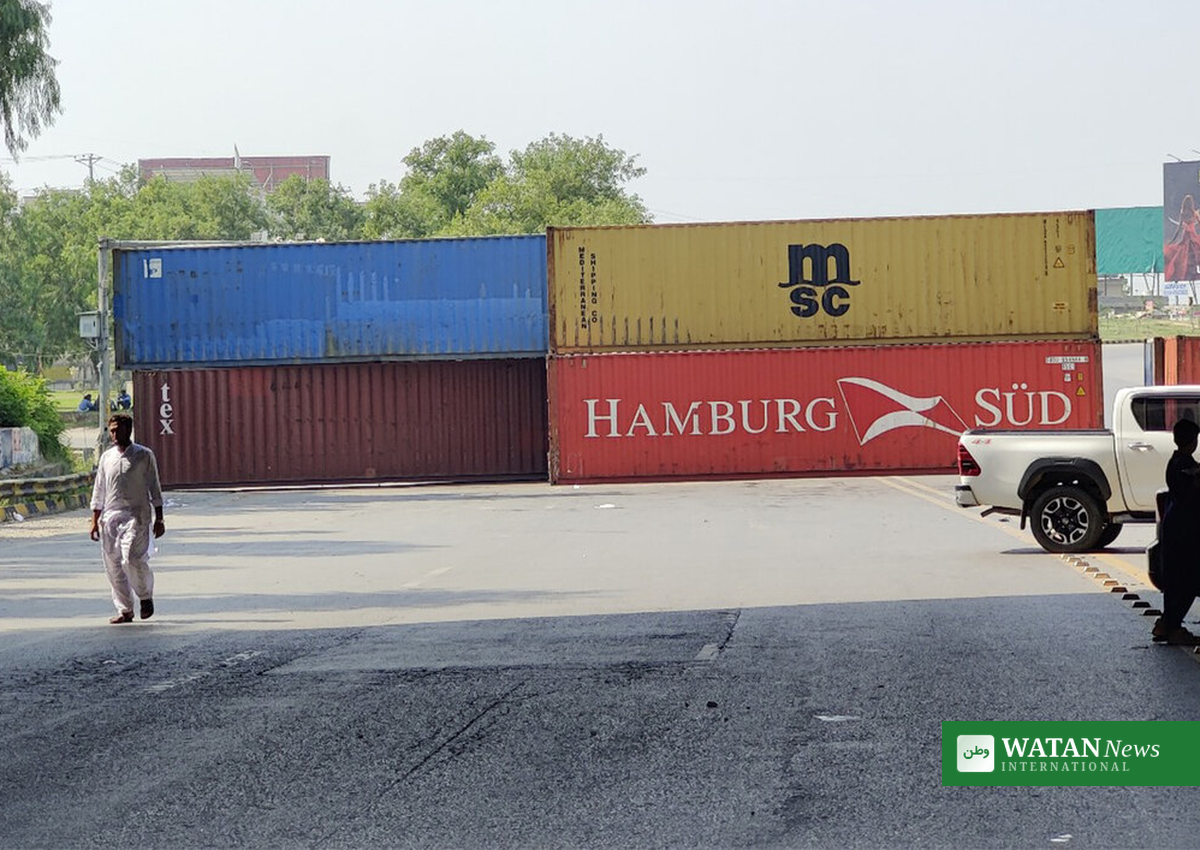 Shipping containers blocking a road into Islamabad during the PTI protest lockdown