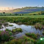 Wind turbines and solar panels on green European hills — EU LIFE programme climate funding