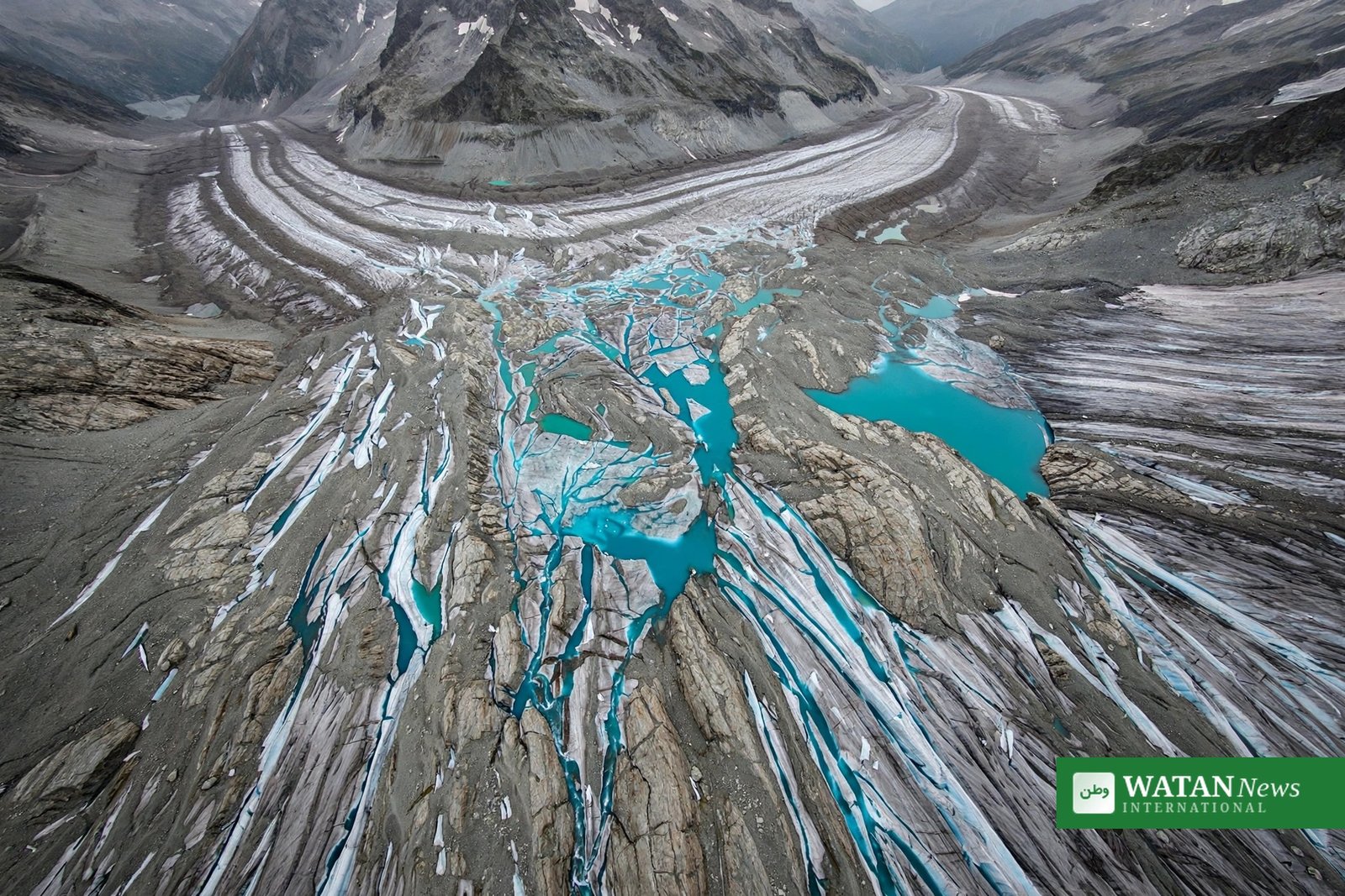 Swiss glaciers ice loss 2026 – aerial view of a retreating glacier with turquoise meltwater lakes and exposed bare rock