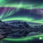 Northern lights aurora over a Scandinavian fjord (illustration)