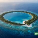 Aerial view of a Pacific coral atoll with turquoise lagoon — Pacific Resilience Facility climate fund
