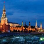 Putin cybersecurity meeting in Moscow: the Kremlin at dusk with a digital network overlay