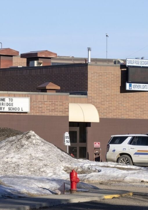 Tumbler Ridge Secondary School with RCMP police vehicle after the February 2026 school shooting