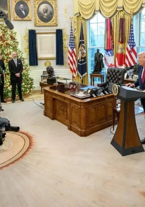 Donald Trump speaks at a podium in the Oval Office during a press briefing on Iran