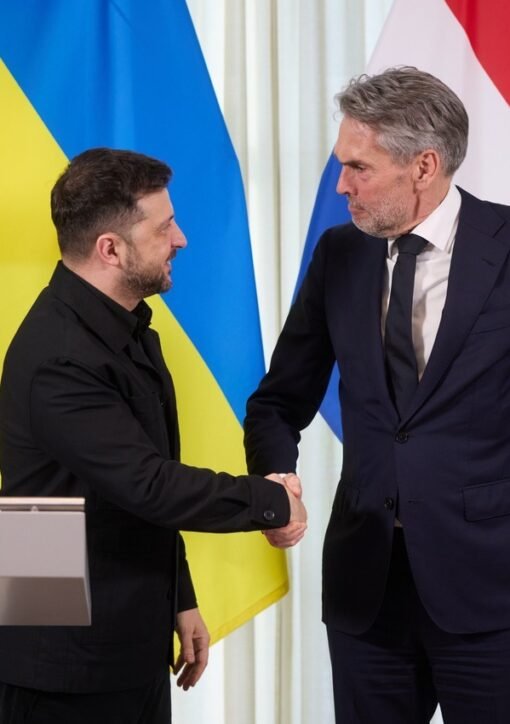 Ukrainian President Volodymyr Zelenskyy shaking hands at a meeting in The Hague; the Zelenskiy energy truce offer came on Sunday