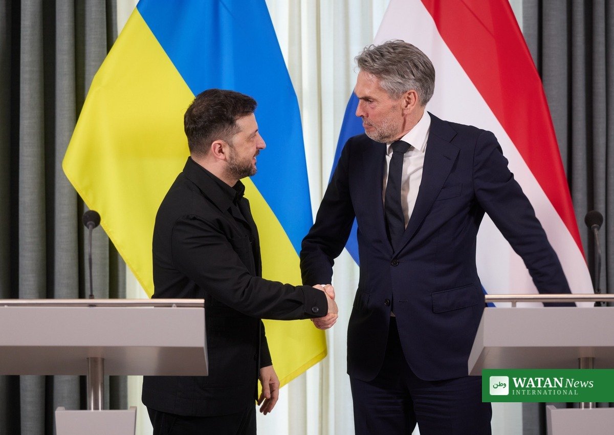 Ukrainian President Volodymyr Zelenskyy shaking hands at a meeting in The Hague; the Zelenskiy energy truce offer came on Sunday